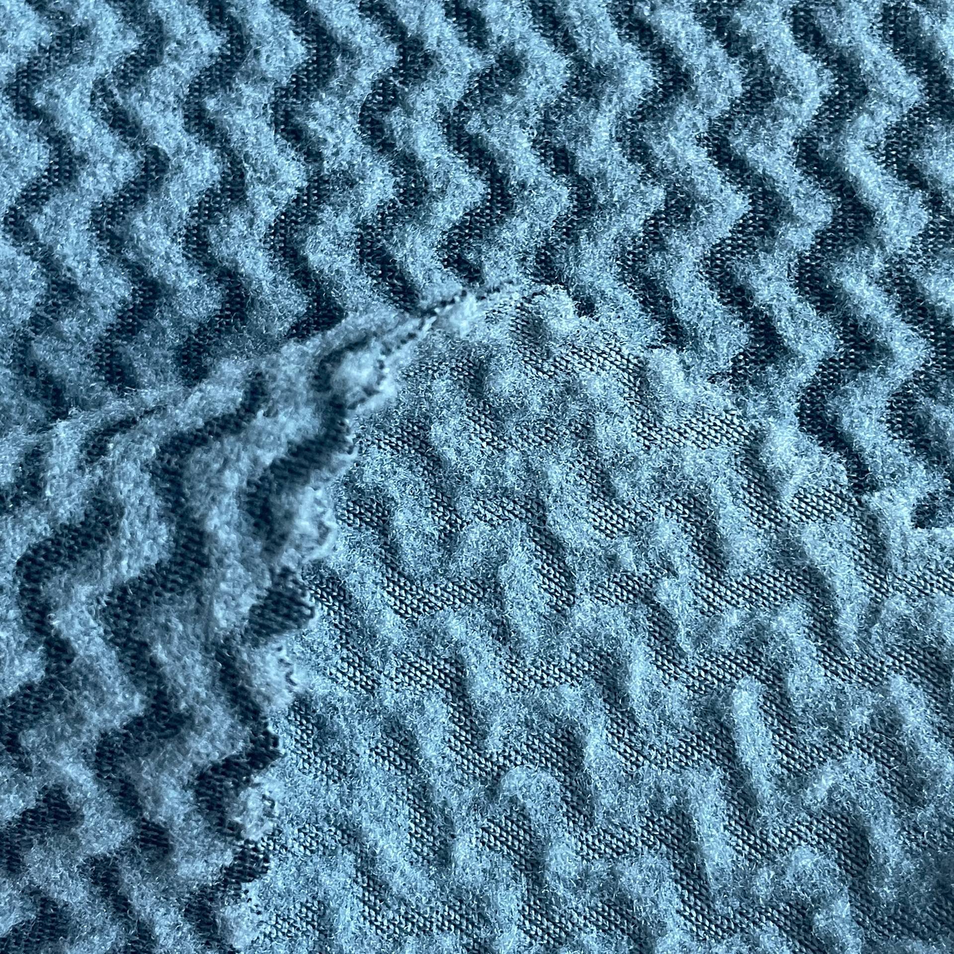 100% पुनर्नवीनीकरण पॉलिएस्टर: टिकाऊ आरई जैक्वार्ड पोलर ऊन